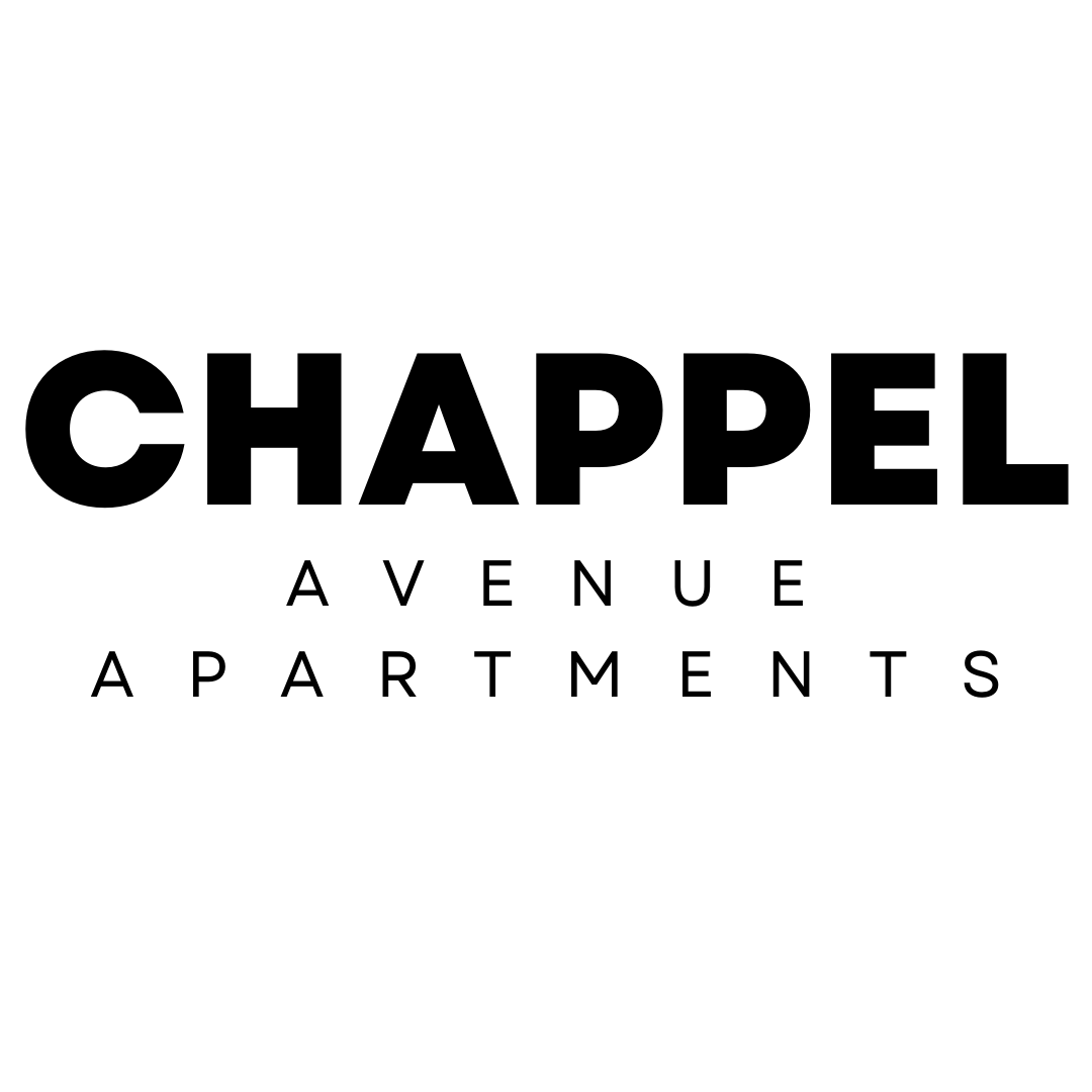 A green sign with the words "Chappel Avenue Apartments" in black.